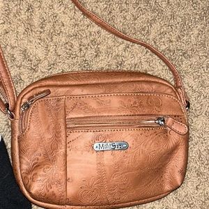 A cross body tan bag